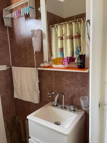 a bathroom with a sink and a mirror at Arenales 2111 Recoleta in Buenos Aires