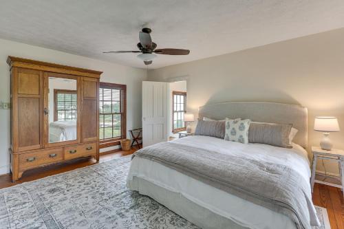a bedroom with a bed and a ceiling fan at Waterfront Home with Large Yard, Dock & Bay View in Heathsville