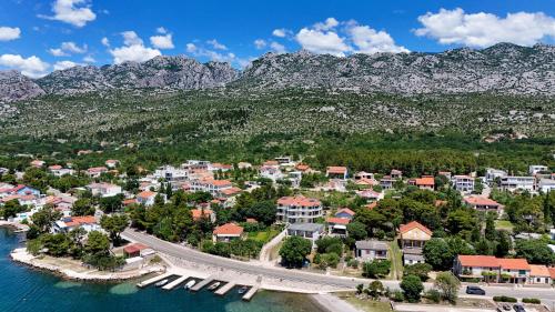 an aerial view of a resort with mountains in the background at Vila Velebita in Seline