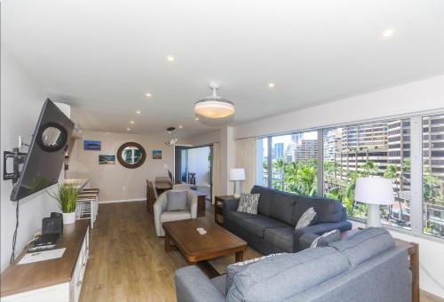 a living room with a couch and a table at Ilikai Tower 525 in Honolulu