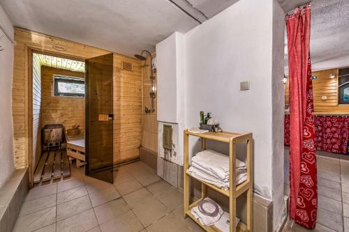 a bathroom with a walk in shower next to a toilet at Chlúpka u Luisa in Telgárt