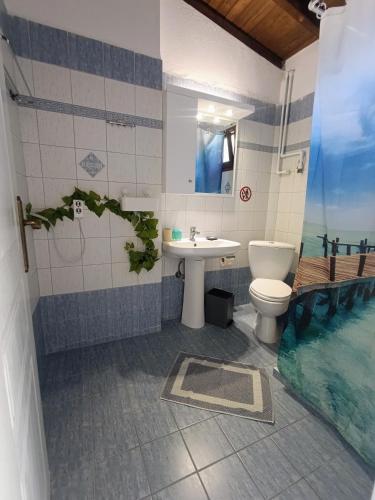 a bathroom with a sink and a toilet at XD Al Mare in Ierissos