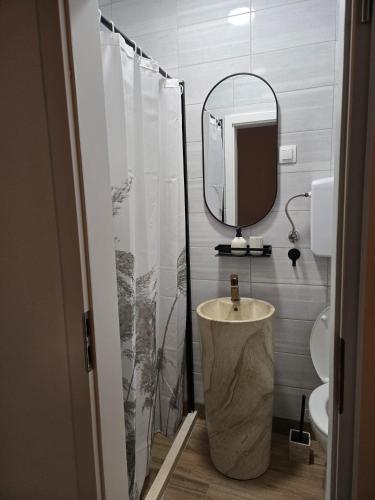 a bathroom with a sink and a mirror at Moreto in Slano