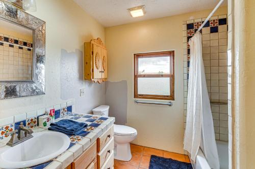 a bathroom with a sink and a toilet and a shower at Adobe-Style Taos Home with Great Views! in Taos