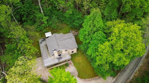 an overhead view of a house in the middle of a forest at Moonbeam Chalet in Logan