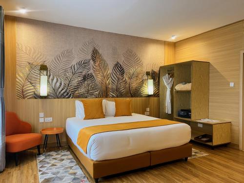 a bedroom with a bed and a wall with a painting at Ridge Cabin Resort in Nairobi