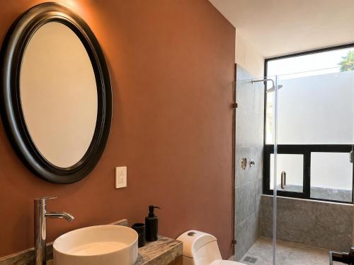a bathroom with a sink and a mirror at Casa DUALIA in San Miguel de Allende