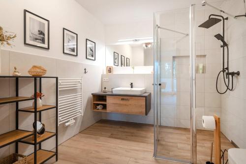 a bathroom with a shower and a sink at Haffhafen in Garz