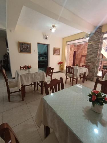 a dining room with tables and chairs in a restaurant at ISIS HOTEl in Tumbes