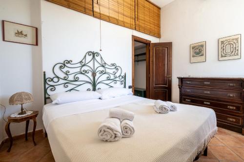a bedroom with a bed with towels on it at Casa Clotilde - nel Cuore di Capri in Capri