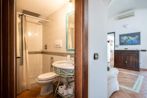 a bathroom with a toilet and a sink at Casa Clotilde - nel Cuore di Capri in Capri