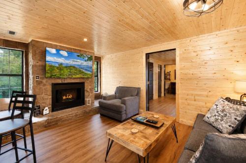 a living room with a couch and a fireplace at Mountain Views at Dolly's Castle Unit 3 in Sevierville