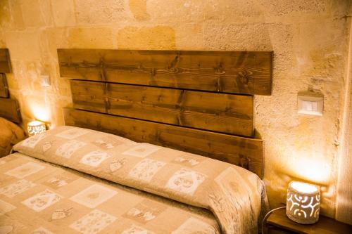 A bed or beds in a room at Casa Rosselli