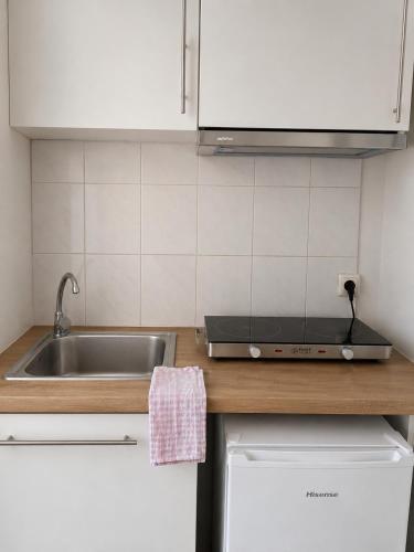 a kitchen with a sink and a counter top at Maria's Studios in Frangokastello