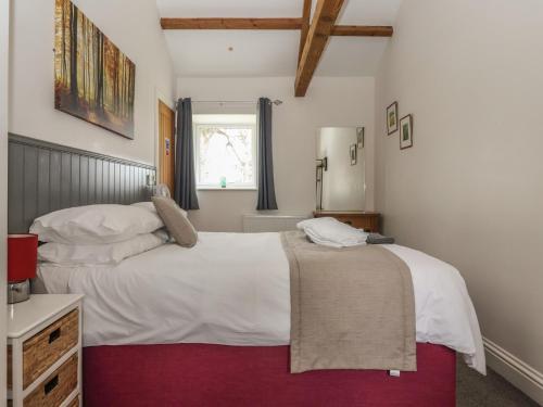 a bedroom with two beds and a window at Shepherd's Crook in Harrogate