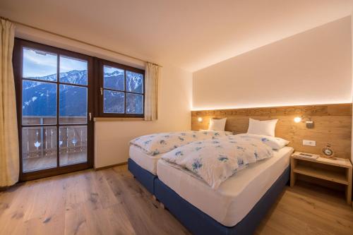 Giường trong phòng chung tại Unterreinischhof