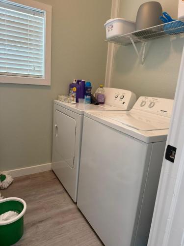 a washer and dryer in a laundry room at Tami Beach Resort Rental in Fort Myers Beach