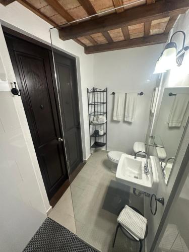 a bathroom with a sink and a toilet at 352 Boutique Guest House in San Juan