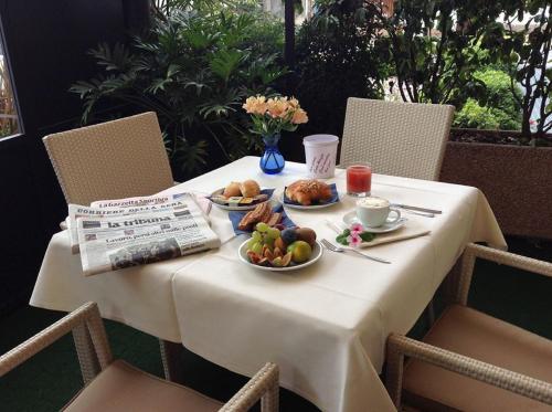 a table with two plates of food on it at Wine Hotel San Giacomo Activity & Wellness in Paderno del Grappa
