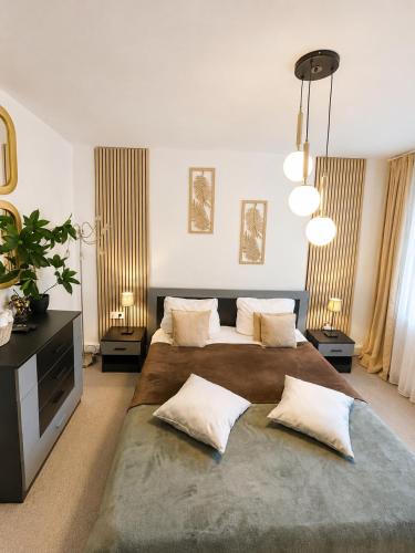 a bedroom with two beds with pillows at Guest House Rila in Govedartsi