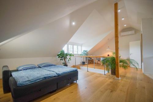 a bedroom with a bed in a attic at Loft Heidelberg West in Heidelberg