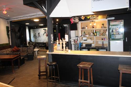 a bar in a restaurant with tables and chairs at studio parc du Vercors in Saint-Romans