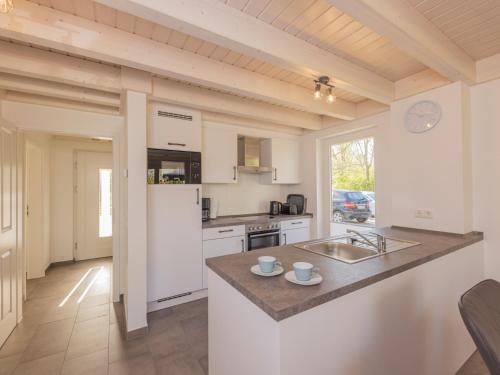 a kitchen with a sink and a counter top at Villa Milla - Nordhorn in Nordhorn