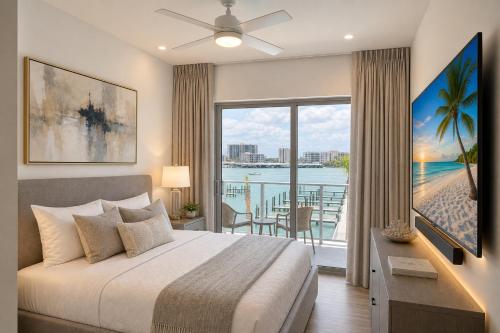 a bedroom with a bed and a view of the ocean at CW Hotel in Clearwater Beach