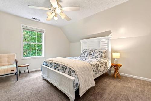 a bedroom with a bed and a ceiling fan at Calm Water Cove in Nebo