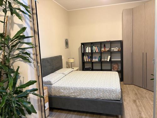 a bedroom with a bed and a mirror at Domu de Ziu Peppino in Sìnnai
