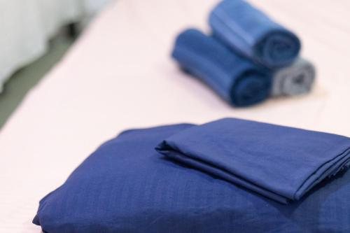 a pair of blue napkins sitting on a table at Sunset View, Taganga in Taganga