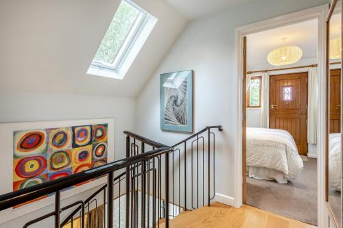 a staircase leading to a bedroom with a bed at 2 Bed in Woodbridge oc-owls in Ufford