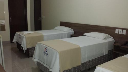 Ένα ή περισσότερα κρεβάτια σε δωμάτιο στο Garcia Palace Hotel