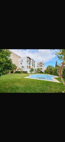a picture of a house and a swimming pool at Residence oum kaltoum in Oued Laou