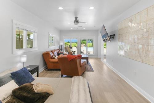 a living room with a couch and a chair at Private Luxury Pool House Retreat in Lake Charles