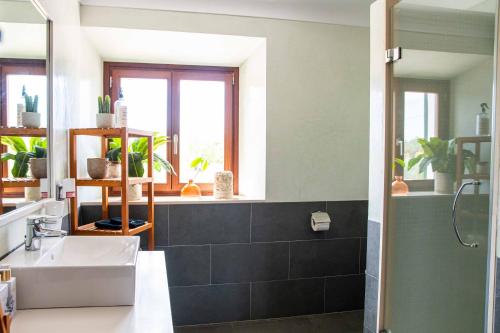 a bathroom with a sink and a mirror at Barkala Mula in Artá