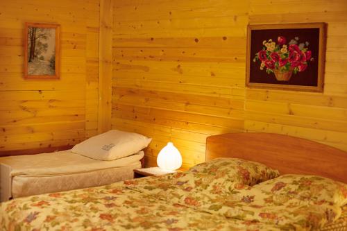 
Кровать или кровати в номере Гостевой дом Пужалова Изба
