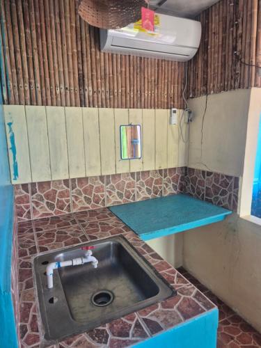 a kitchen with a sink in a room at Cabañas T Estefany in Bocas Town