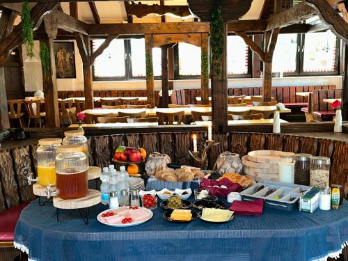 a blue table with food on it in a restaurant at Hotel Main Taunus in Hochheim am Main
