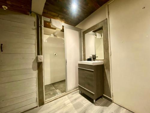 a bathroom with a sink and a mirror at Casa Regina CDMX in Mexico City