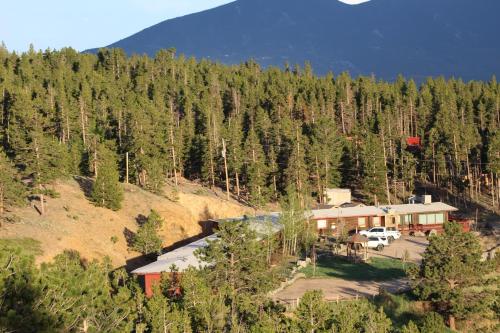 an aerial view of a lodge in the middle of a forest at Sundance Lodge in Nederland