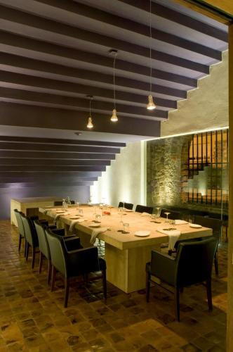 a large dining room with a large table and chairs at La Purificadora, Puebla, a Member of Design Hotels in Puebla