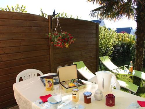 a white table with a laptop on top of it at La Maison des Îles & Spa privatif in Baden