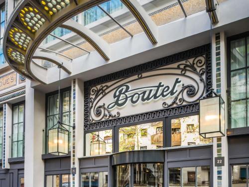 a store front with a sign for a boutique at Boutet Bastille Hotel Paris - MGallery Collection in Paris
