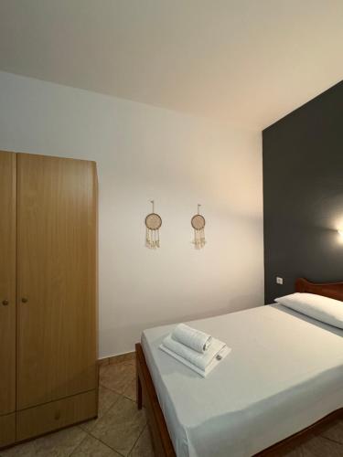 a bedroom with a bed with two towels on it at Dream Catcher 5 in Agia Theodoti