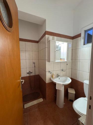 a bathroom with a sink and a shower and a toilet at Dream catcher 4 in Ios Chora