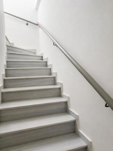 a set of stairs in a building at Ocean Breeze Luxury Loft in Psathopyrgos