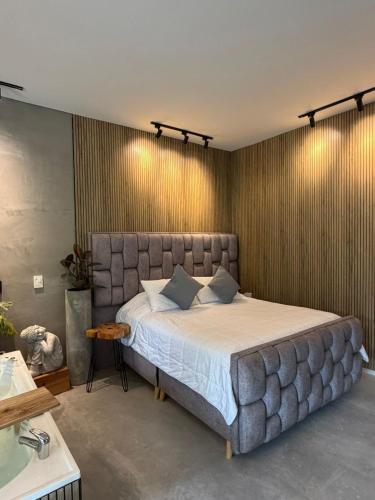 a bedroom with a large bed in a room at Animadbali1 in Ibagué