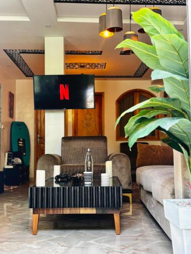a living room with a coffee table and a couch at Garden view double room in Agadir