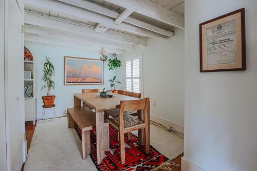 a dining room with a wooden table and chairs at The Mariposa in Staunton